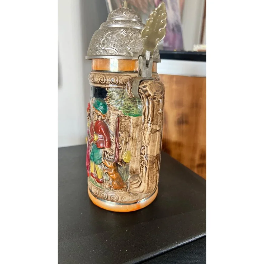 Vintage German musical beer stein,  embossed painted scenes, hinged pewter lid
